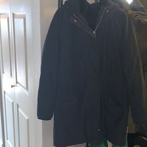 Black wind, water resistant jacket with a removable liner. It’s well used